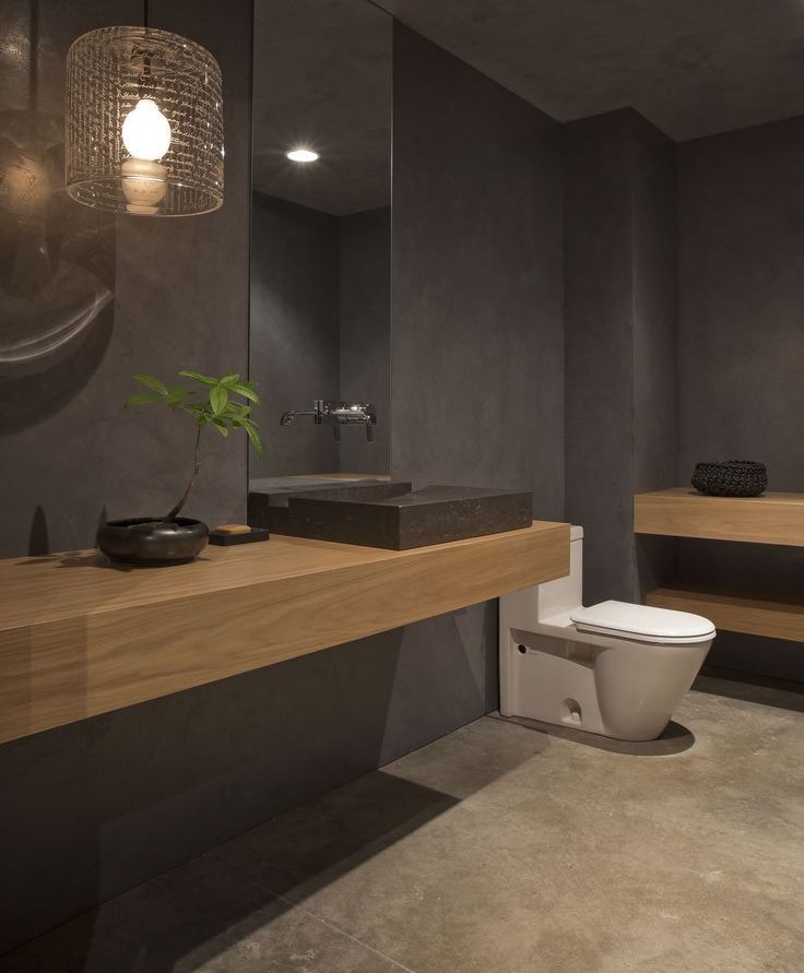 White toilet in the bathroom with brown interior