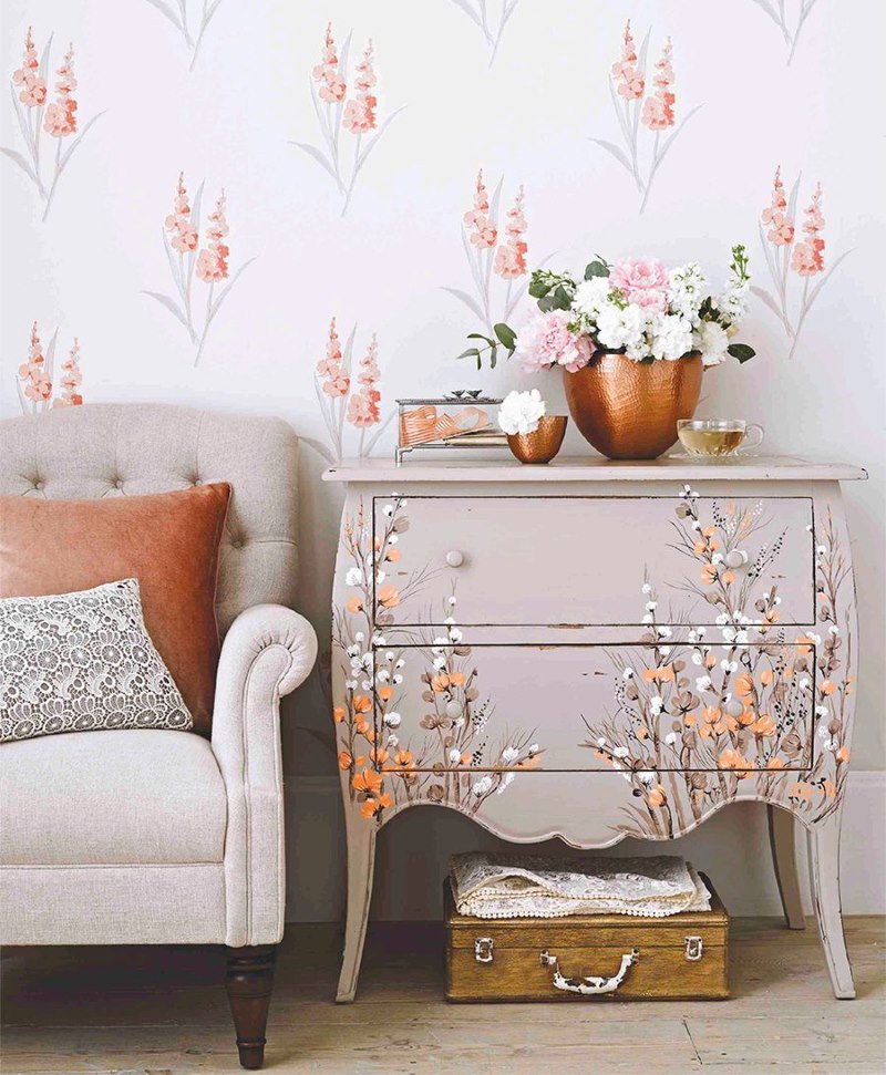 Bedside table with painted flowers and bouquets on the wallpaper
