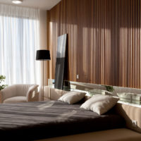 Wall decoration in the bedroom with wooden battens