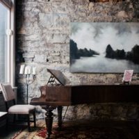 Piano on a stone wall background