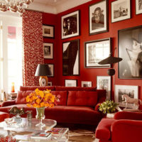 Paintings on the red wall in the living room