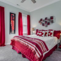 White bedroom with red accents