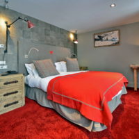 Gray walls and red floor in the bedroom