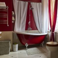White curtains in a red bathtub