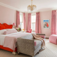 Interior of a pink bedroom with a classic chandelier