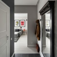 Black tile in the hallway with gray walls