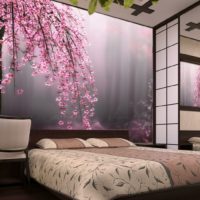 Realistic photo wallpaper with flowers over the head of the bed