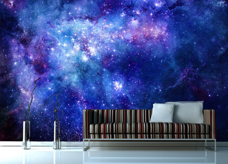 Wall decoration over the sofa in space-themed murals