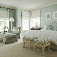 Mint color in the interior of a spacious bedroom in a country house