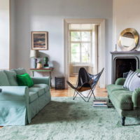 Mint-colored sofas and carpet in the same colors