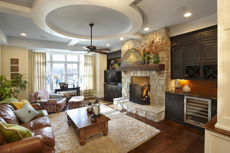 Fireplace with natural stone trim in the living room of a private house