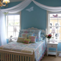 White bed in a blue nursery
