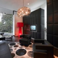Red floor lamp and black furniture