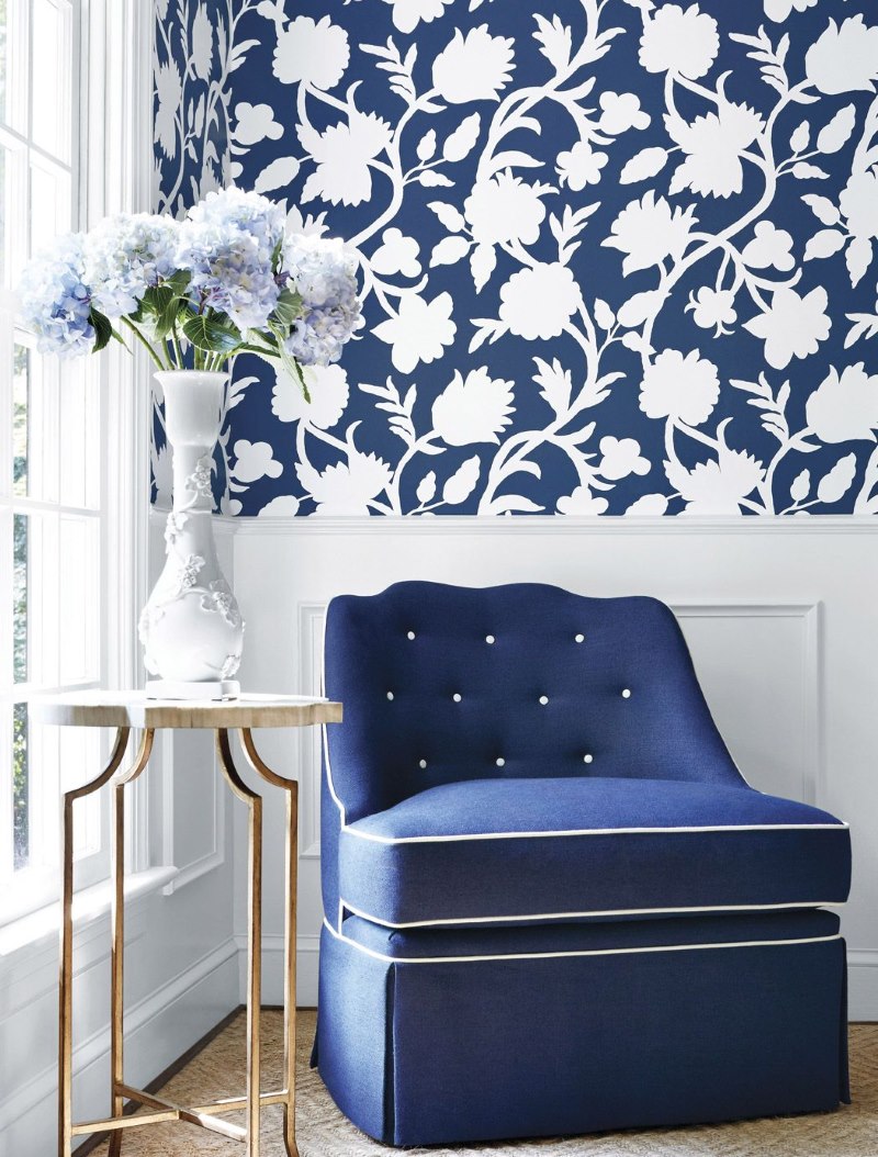 Blue and white wallpaper in a large flower in the interior of the living room