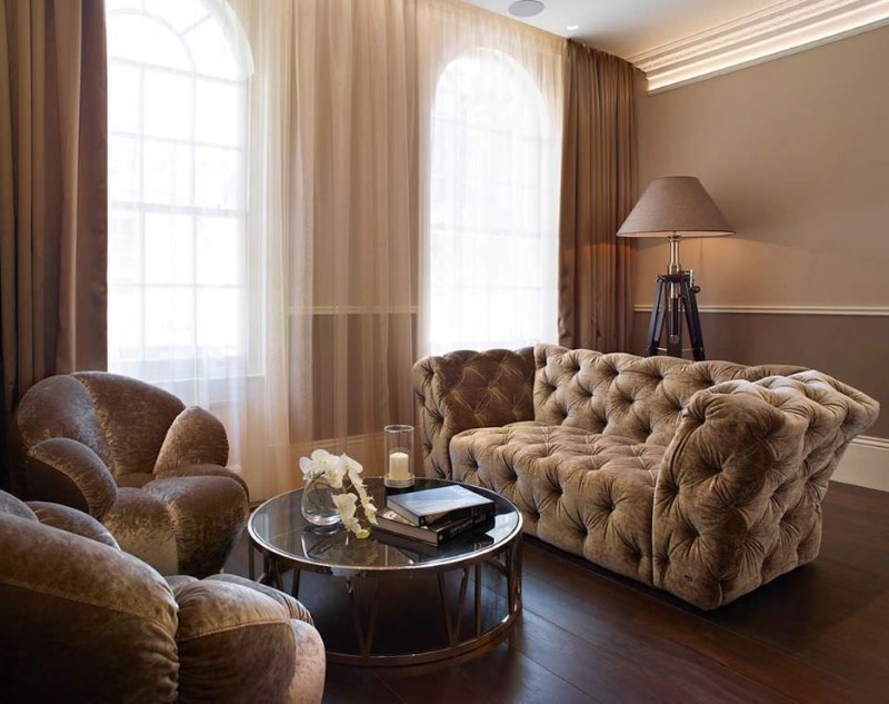 Upholstered furniture with brown upholstery in the interior of a modern living room