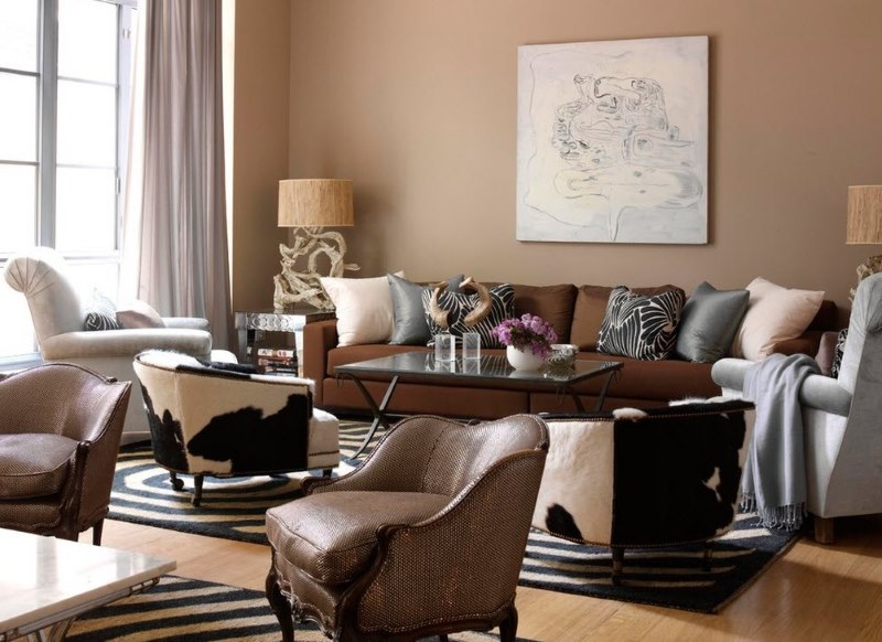 Brown sofa with fabric upholstery in the living room with beige walls