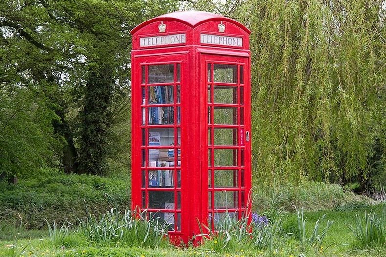English red telephone booths in landscaping