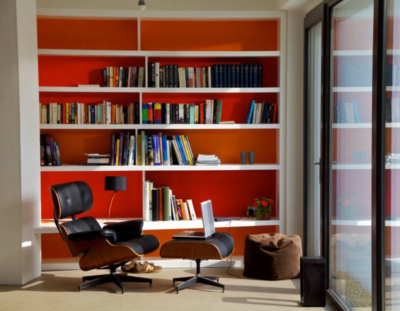 Bookcase with red background