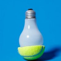 Old tennis ball for twisting a hot light bulb