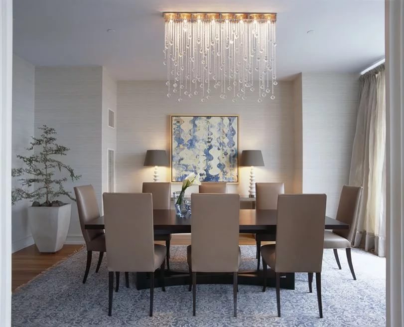 Modern chandelier in the interior of the living room of a city apartment