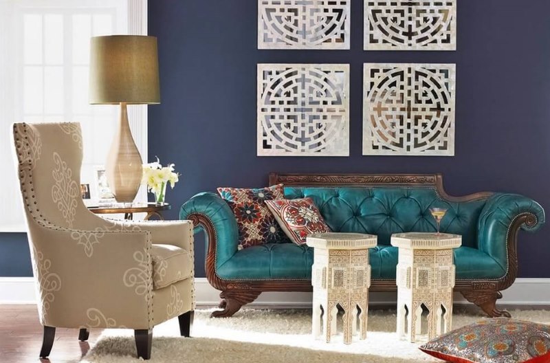 Poufs, an armchair and a sofa in a Moroccan-style living room
