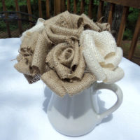 pitcher with artificial burlap flowers