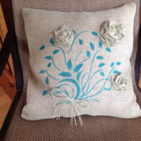 Decorative pillow with colored embroidery