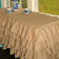 Tea table covered with burlap tablecloth