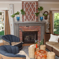 Living room with red brick fireplace