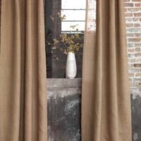 Loft style window with burlap curtains