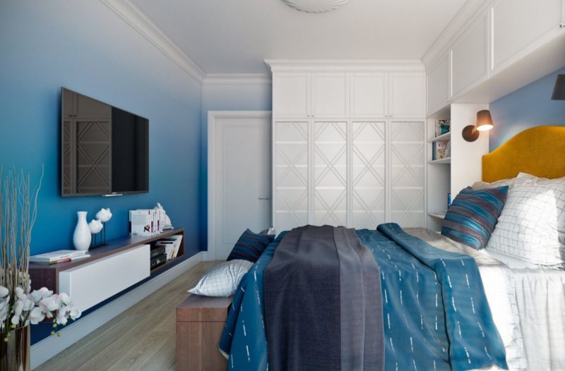 The design of the bedroom of a private house in blue tones