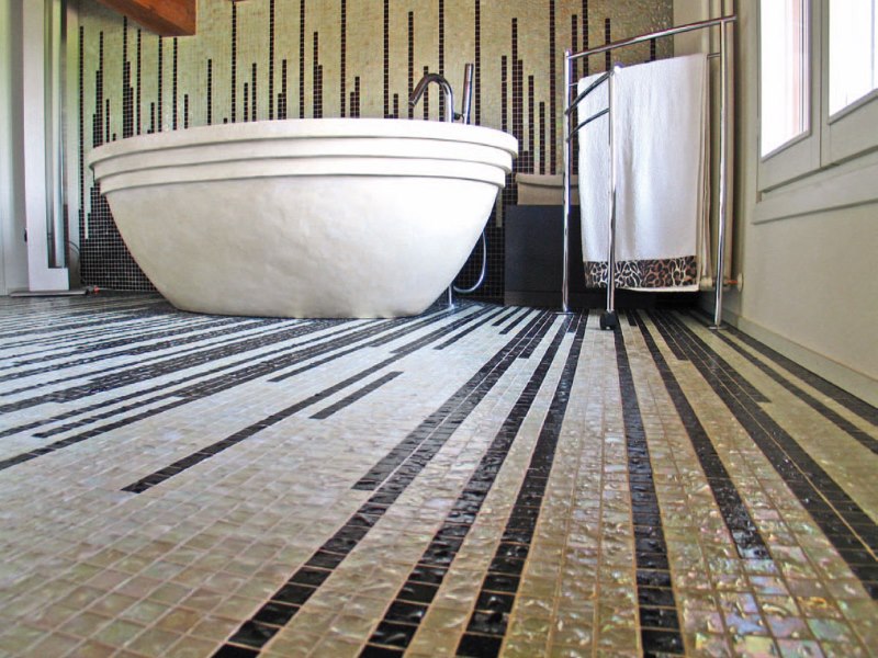 Ceramic mosaic on the bathroom floor of a city apartment
