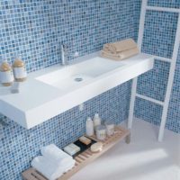 White rectangular sink on mosaic wall