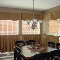 Curtains on the windows of the country-style kitchen