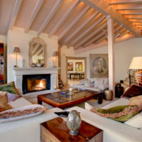 Wooden ceiling in a room with a fireplace