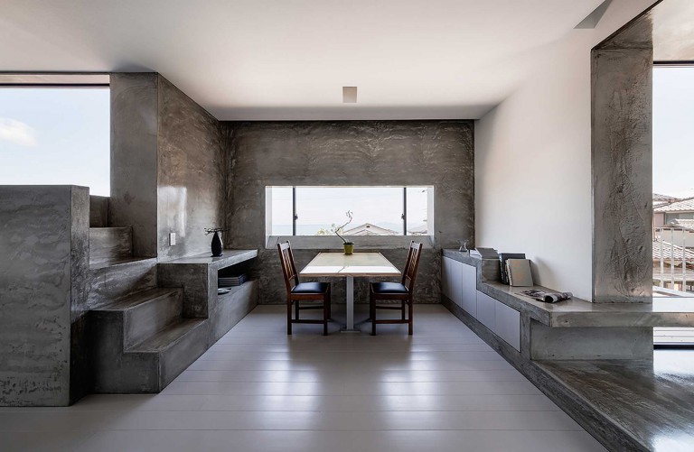 Minimalist two-tone kitchen dining area interior