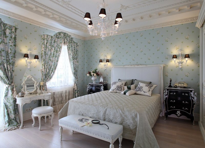 Wallpaper with faint flowers in pastel colors on the wall in the bedroom