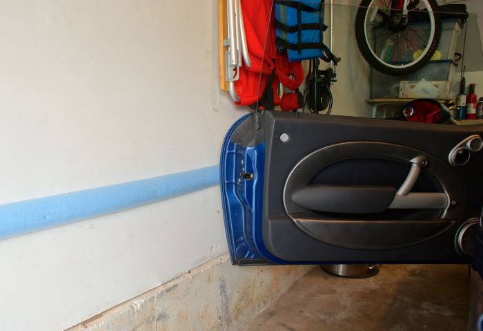 Protecting car doors when opening in the garage