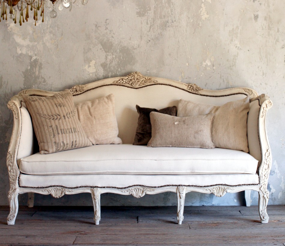 Provence-style burlap pillows on a sofa