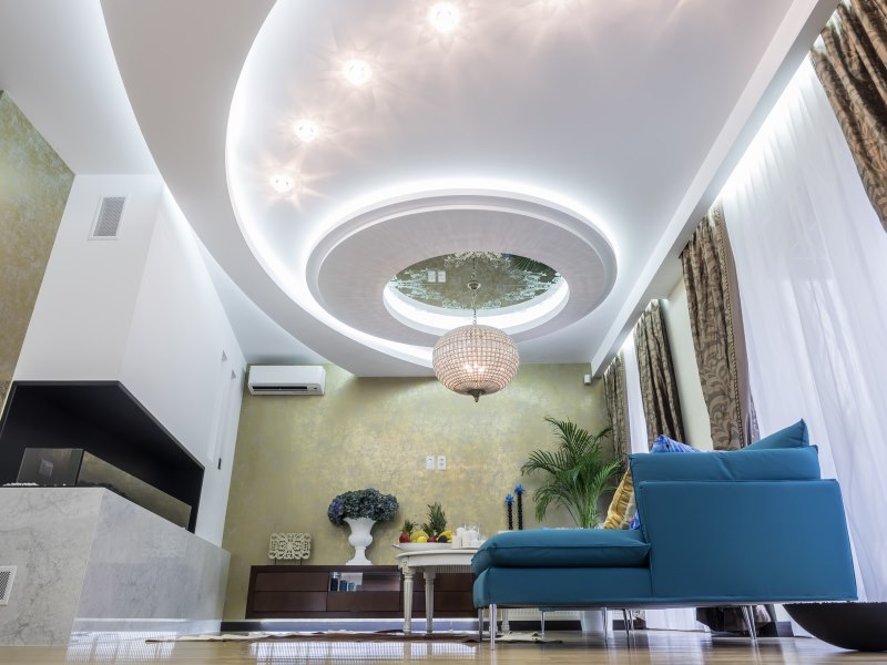 Beautiful ceiling design with bright lighting in the hall of a private house