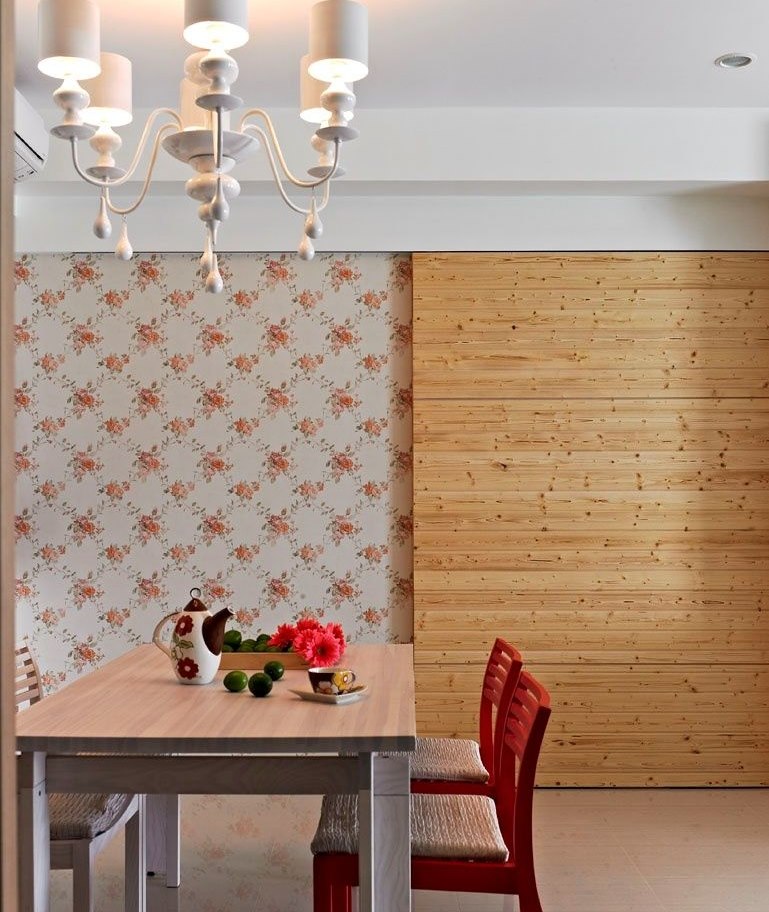 Decorative wood panel on the wall with floral wallpaper