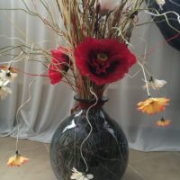 Beautiful flowers in a glass floor vase