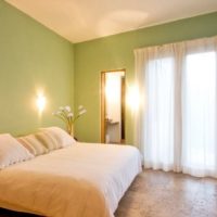 Lighting in the bedroom with green walls