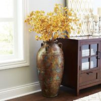 Antique vase with dry branches