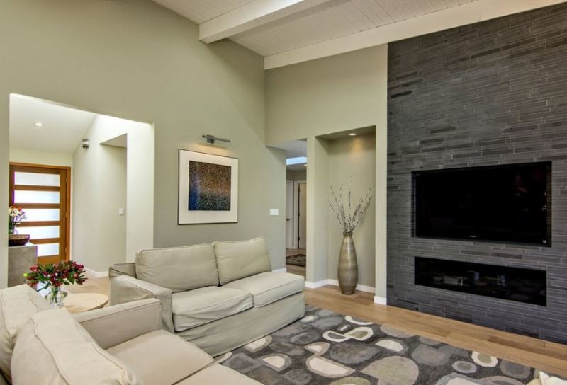 Living room design with dark gray fireplace