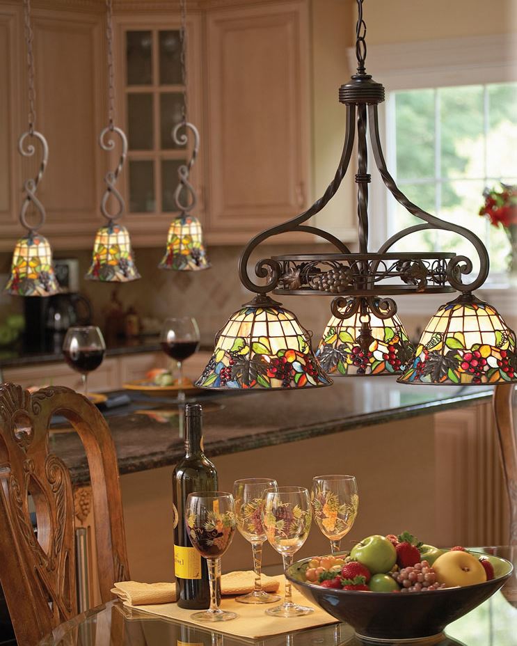 Chandelier with colored glass shades on a forged pendant