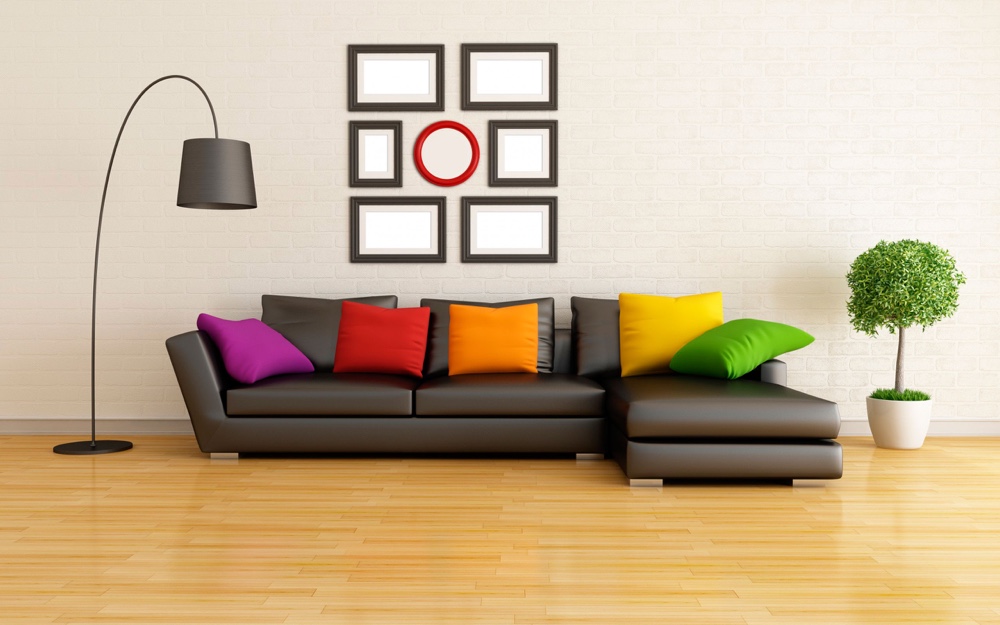 Bright pillows on a brown sofa in a bright living room