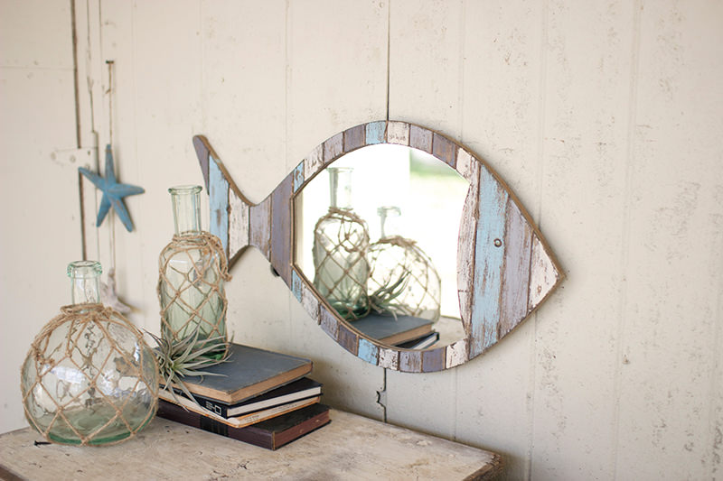 Fish-shaped mirror for decorating a room in a marine style
