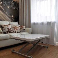 Folding table in front of a sofa in the living room