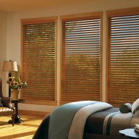 Spouses bedroom with wood blinds